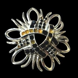 Silver-tone costume brooch withblack and amber rhinestones, Worth& Douglas